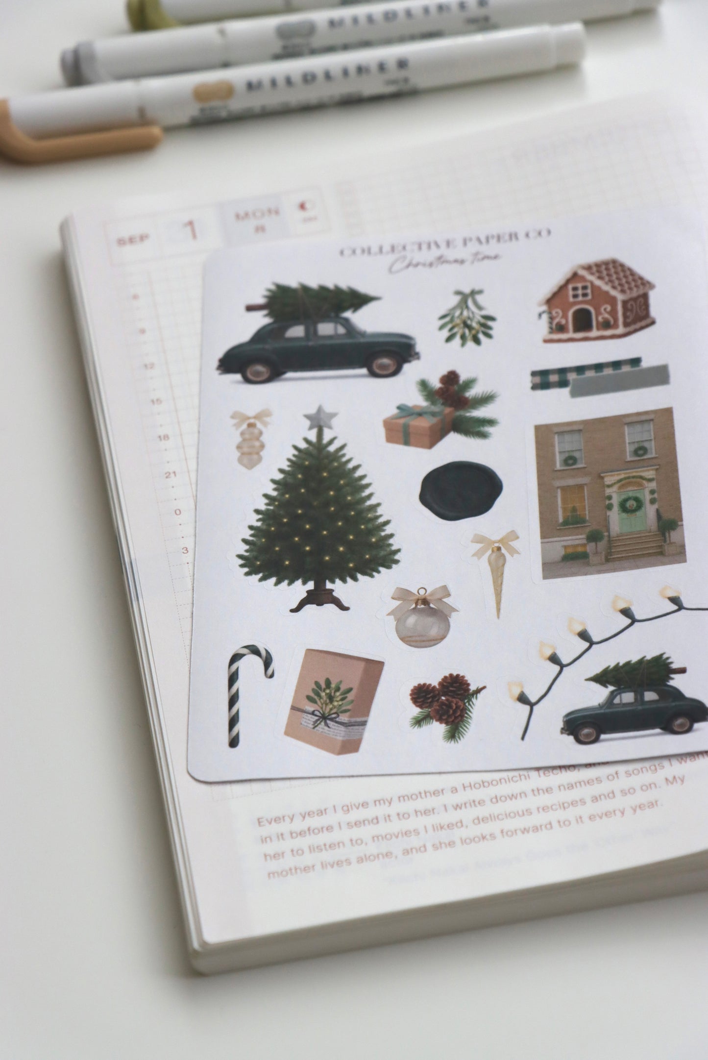 Decorative journaling sheet of kiss-cut vintage and realistic seasonal stickers of Christmas time in winter on Japanese washi paper