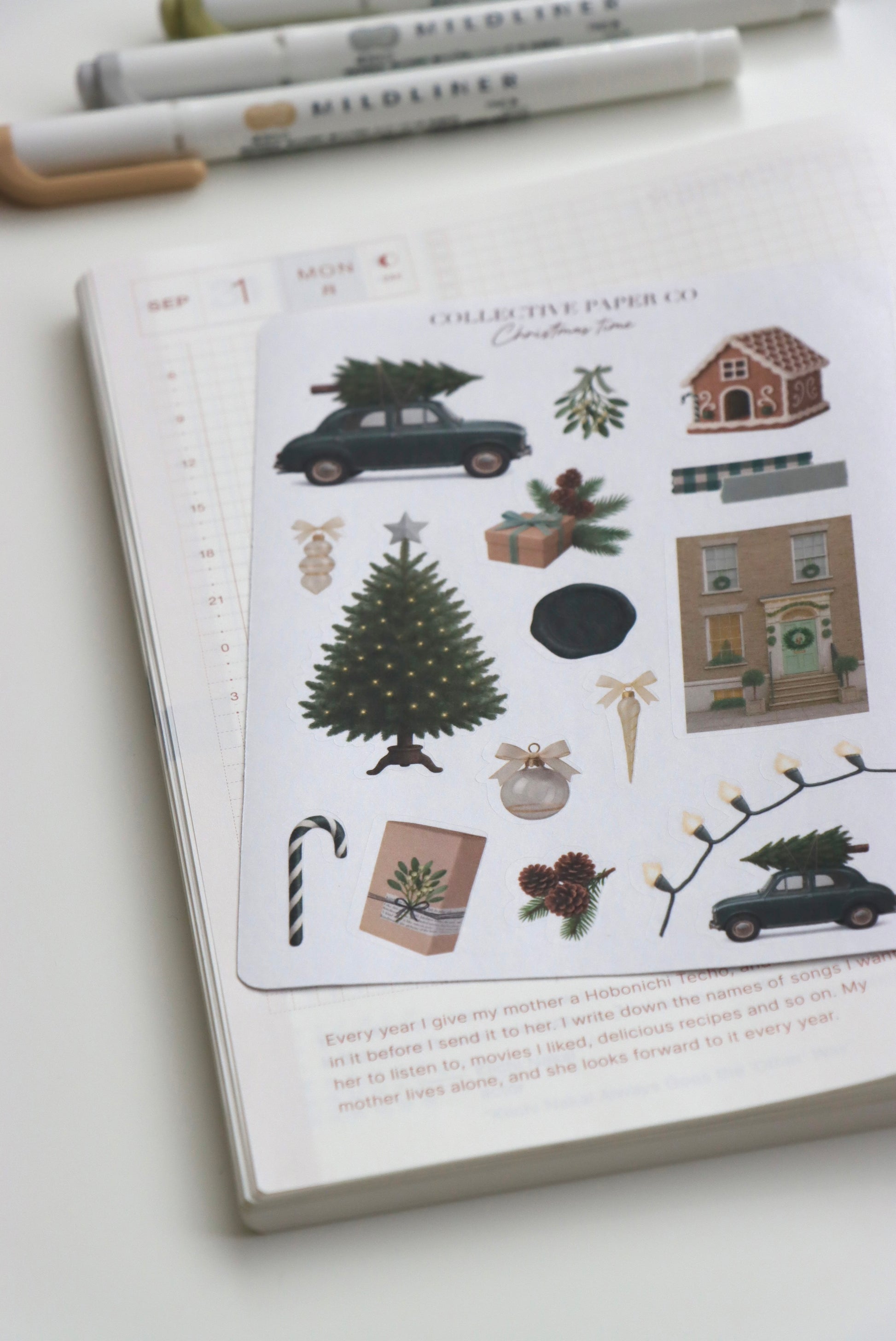 Decorative journaling sheet of kiss-cut vintage and realistic seasonal stickers of Christmas time in winter on Japanese washi paper