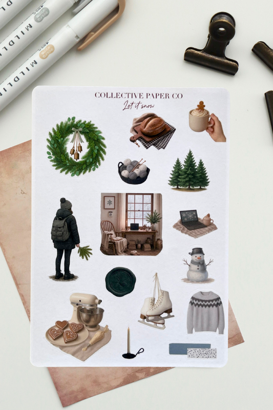 Collection of stickers from Collective Paper Co on a white surface with stationery items.