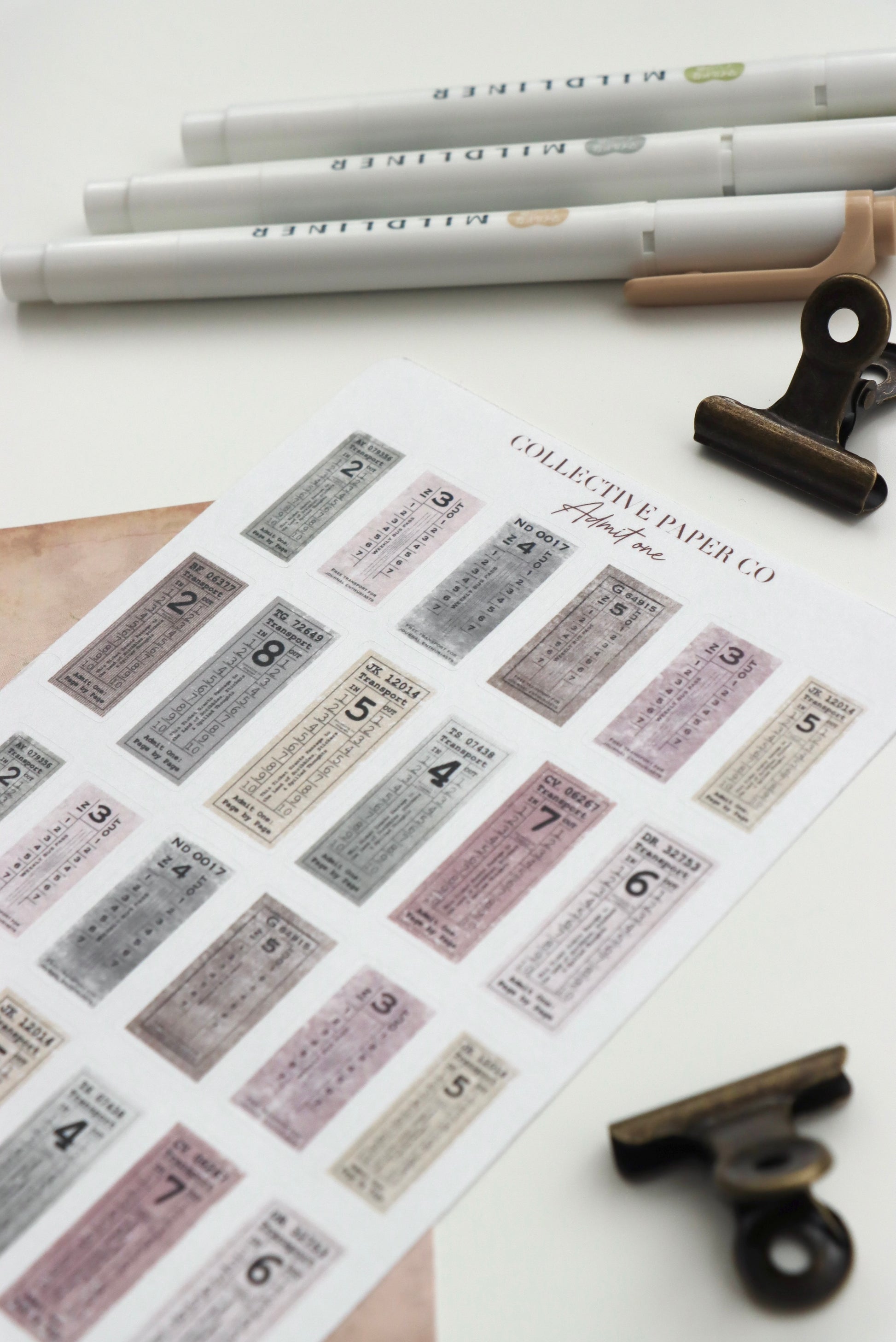 Decorative journaling sheet of kiss-cut vintage and realistic stickers of Admit one tickets on Japanese washi paper