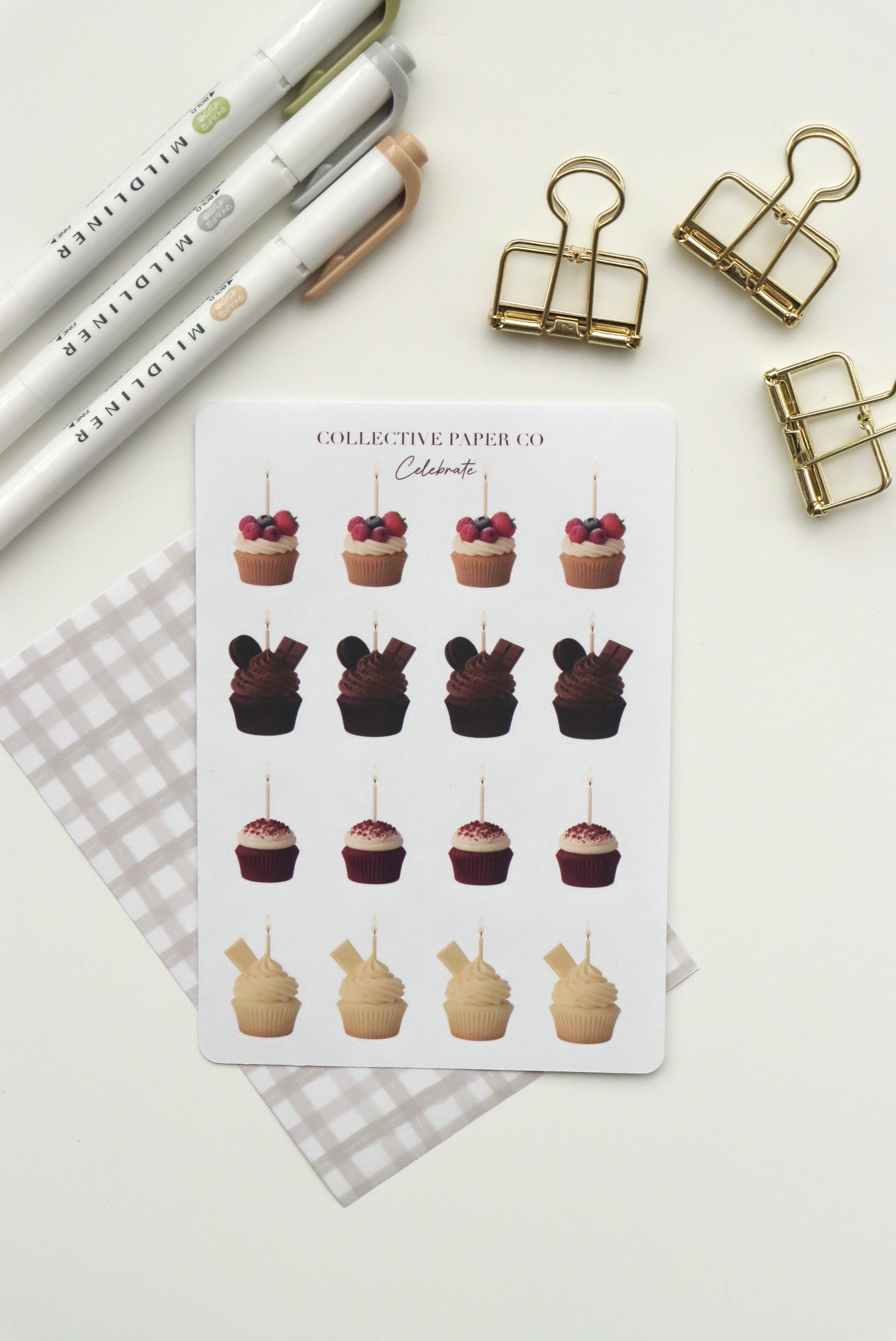 Decorative journaling sheet of kiss-cut vintage and realistic birthday cupcake stickers on Japanese washi paper