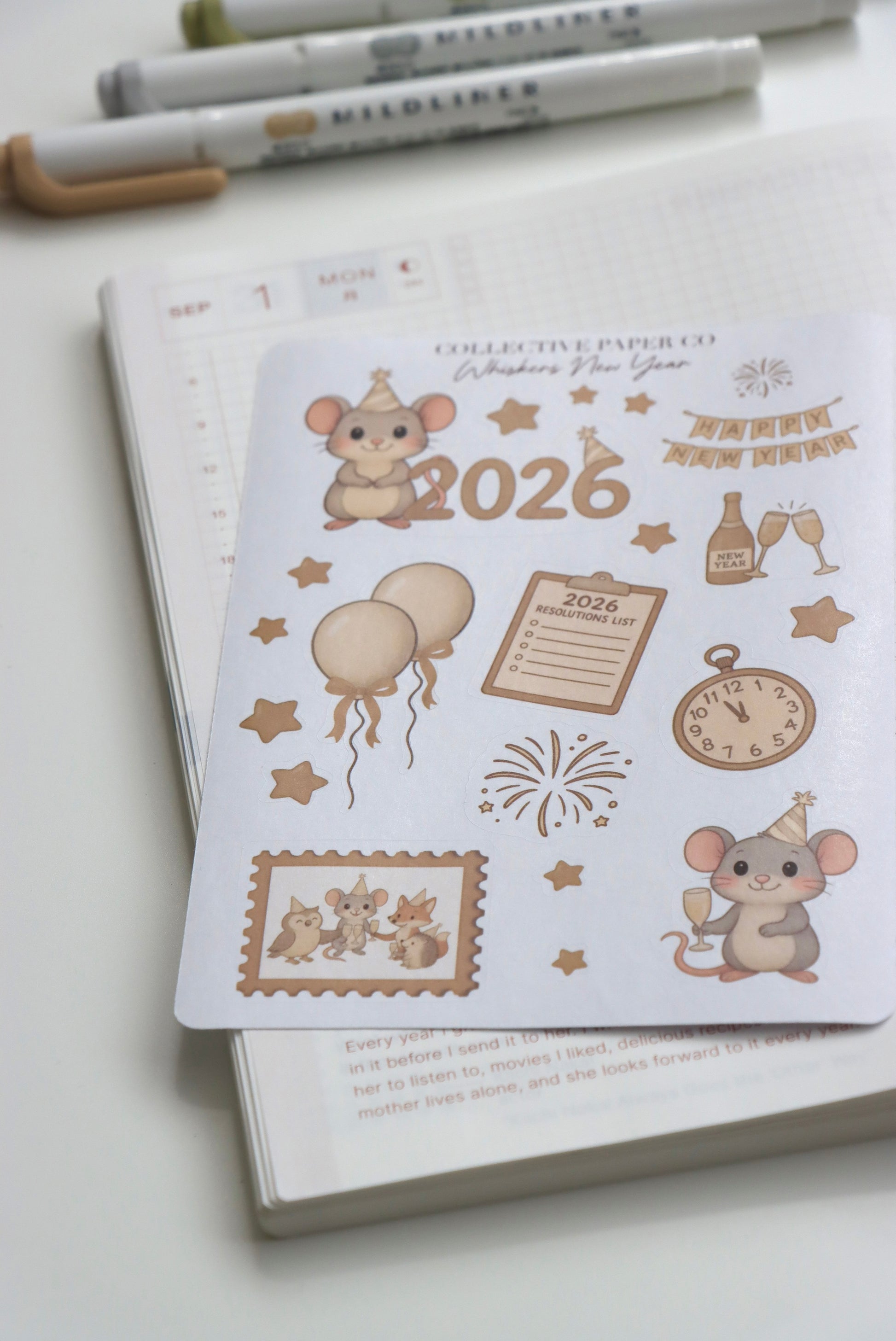 Decorative journaling sheet of kiss-cut seasonal stickers of Whiskers New Year 2026 celebration on Japanese washi paper