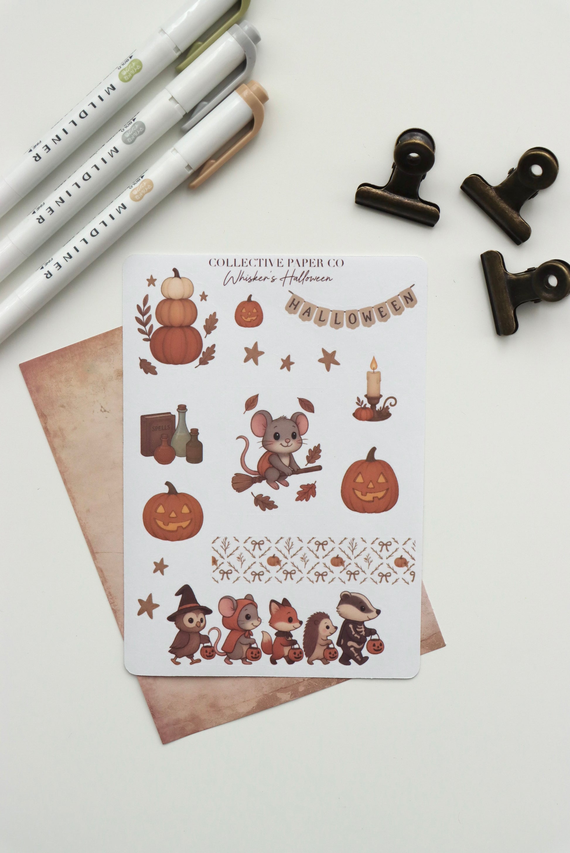 Decorative journaling sheet of kiss-cut seasonal stickers of Whisker's Halloween on Japanese washi paper