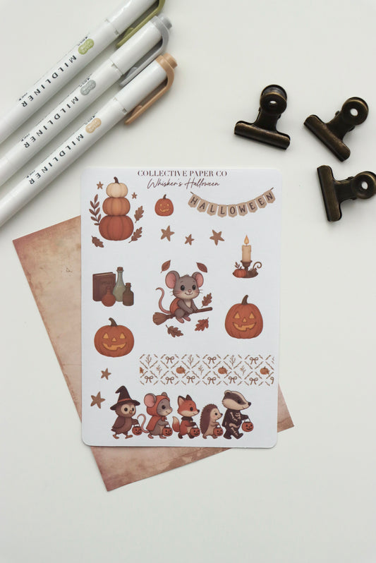 Decorative journaling sheet of kiss-cut seasonal stickers of Whisker's Halloween on Japanese washi paper