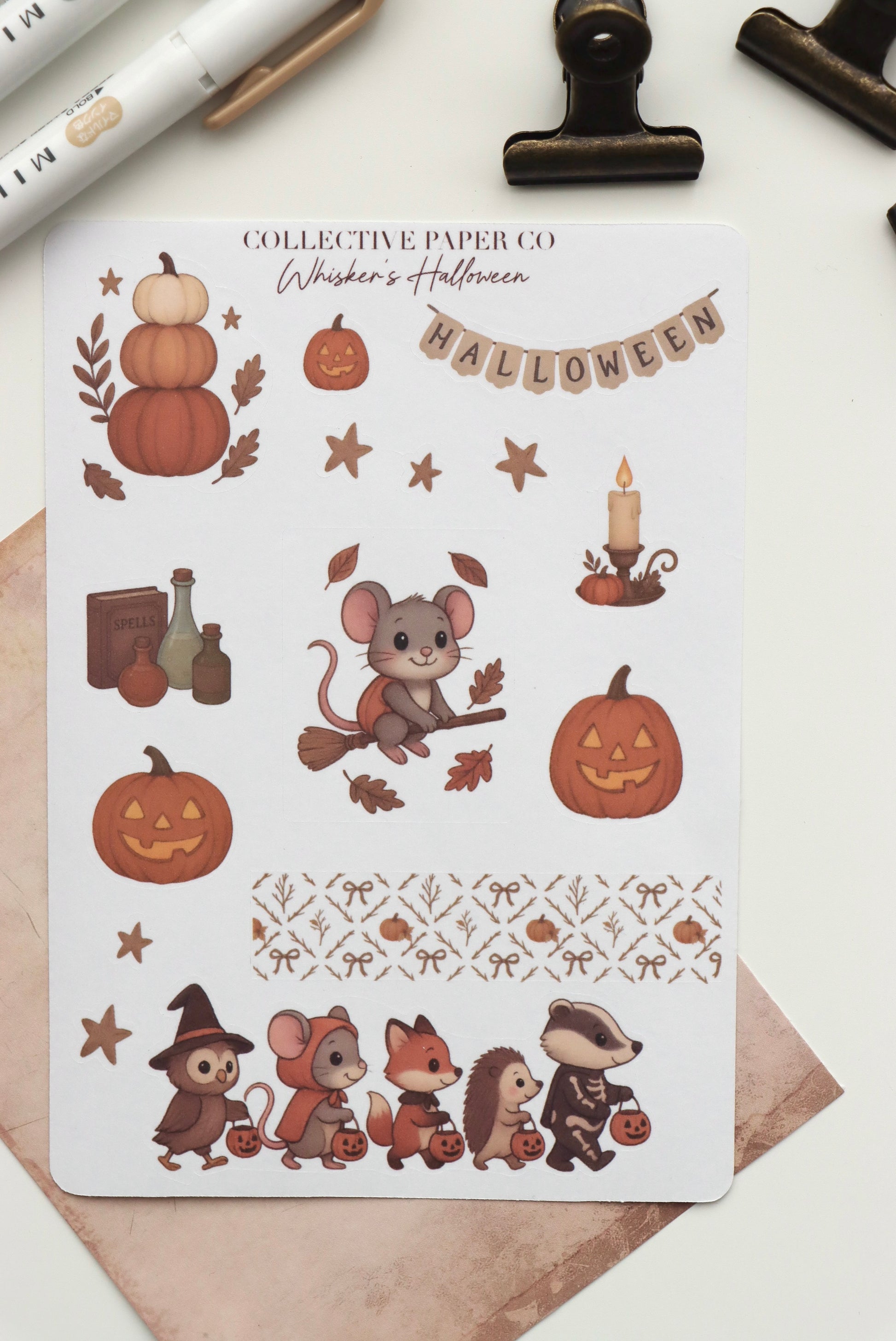 Decorative journaling sheet of kiss-cut seasonal stickers of Whisker's Halloween on Japanese washi paper
