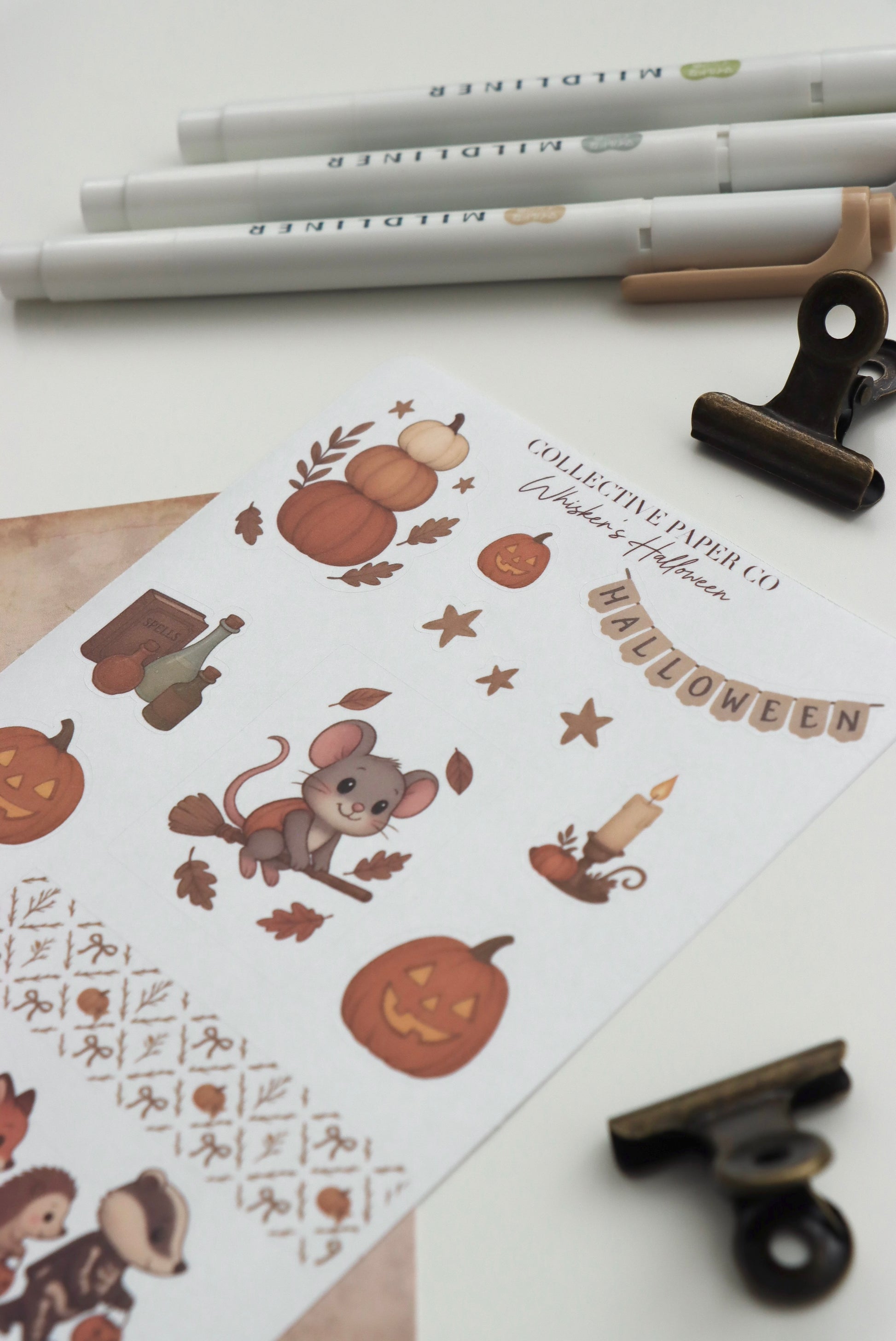 Decorative journaling sheet of kiss-cut seasonal stickers of Whisker's Halloween on Japanese washi paper