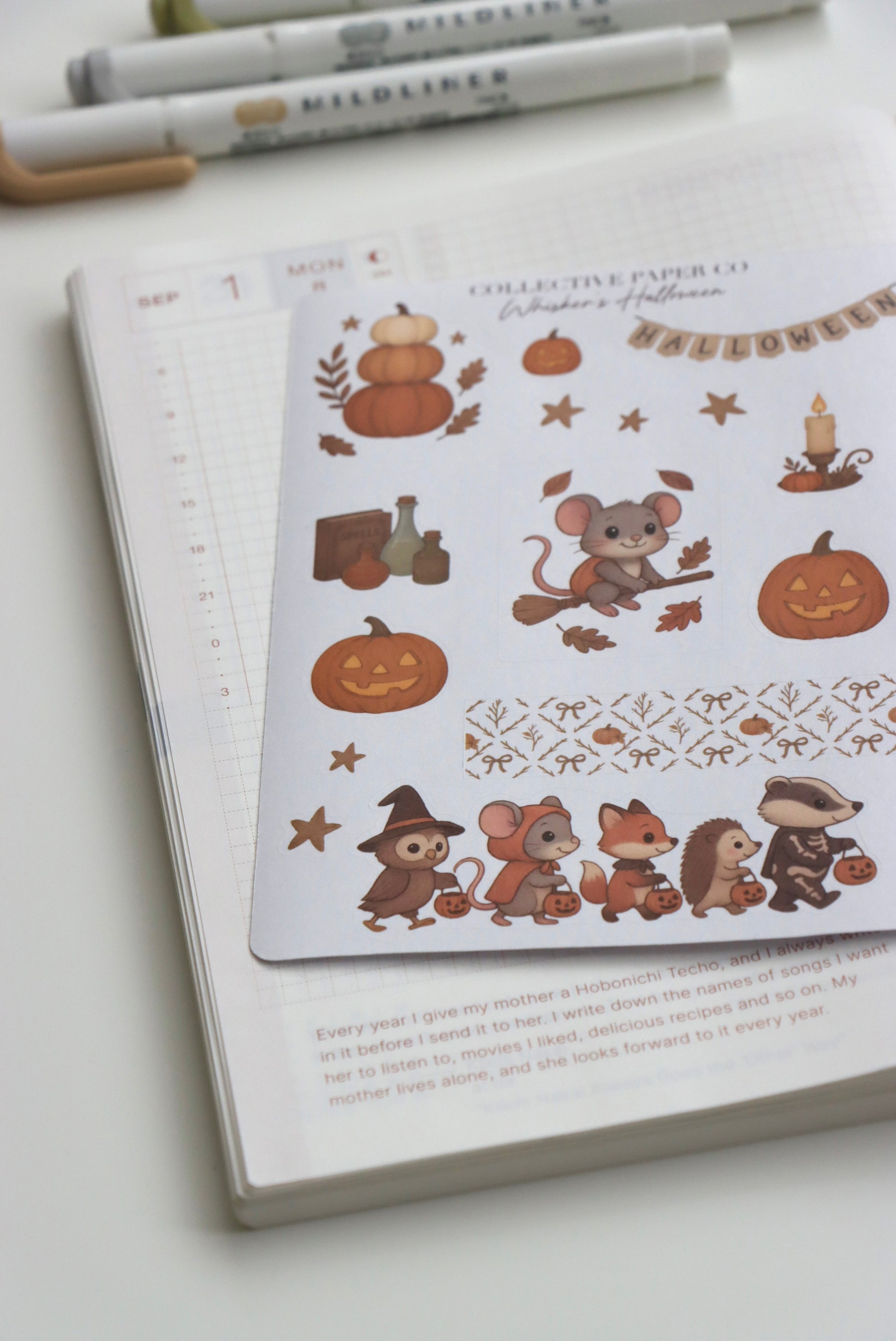 Decorative journaling sheet of kiss-cut seasonal stickers of Whisker's Halloween on Japanese washi paper