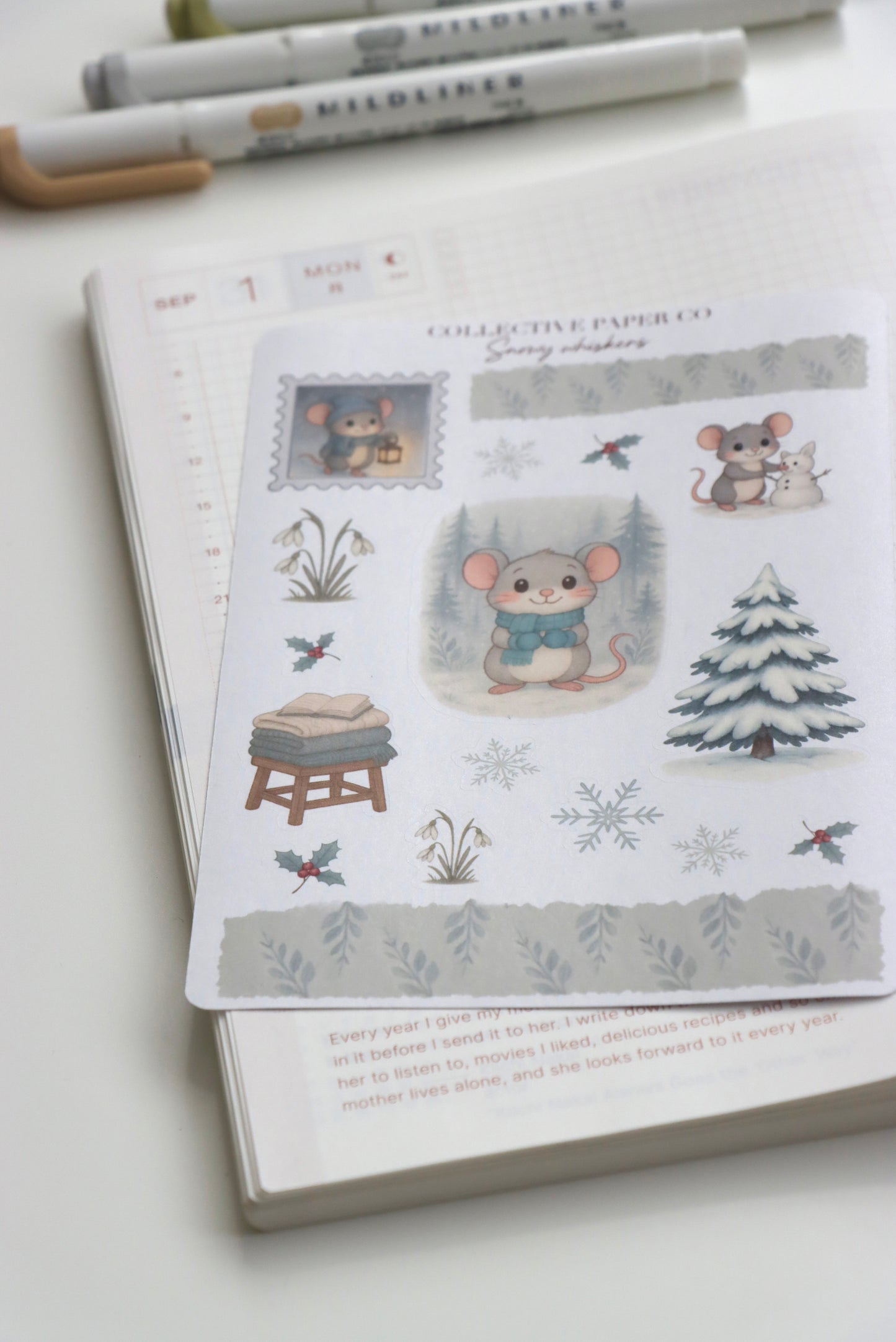 Decorative journaling sheet of kiss-cut seasonal stickers of Snowy Whiskers on Japanese washi paper