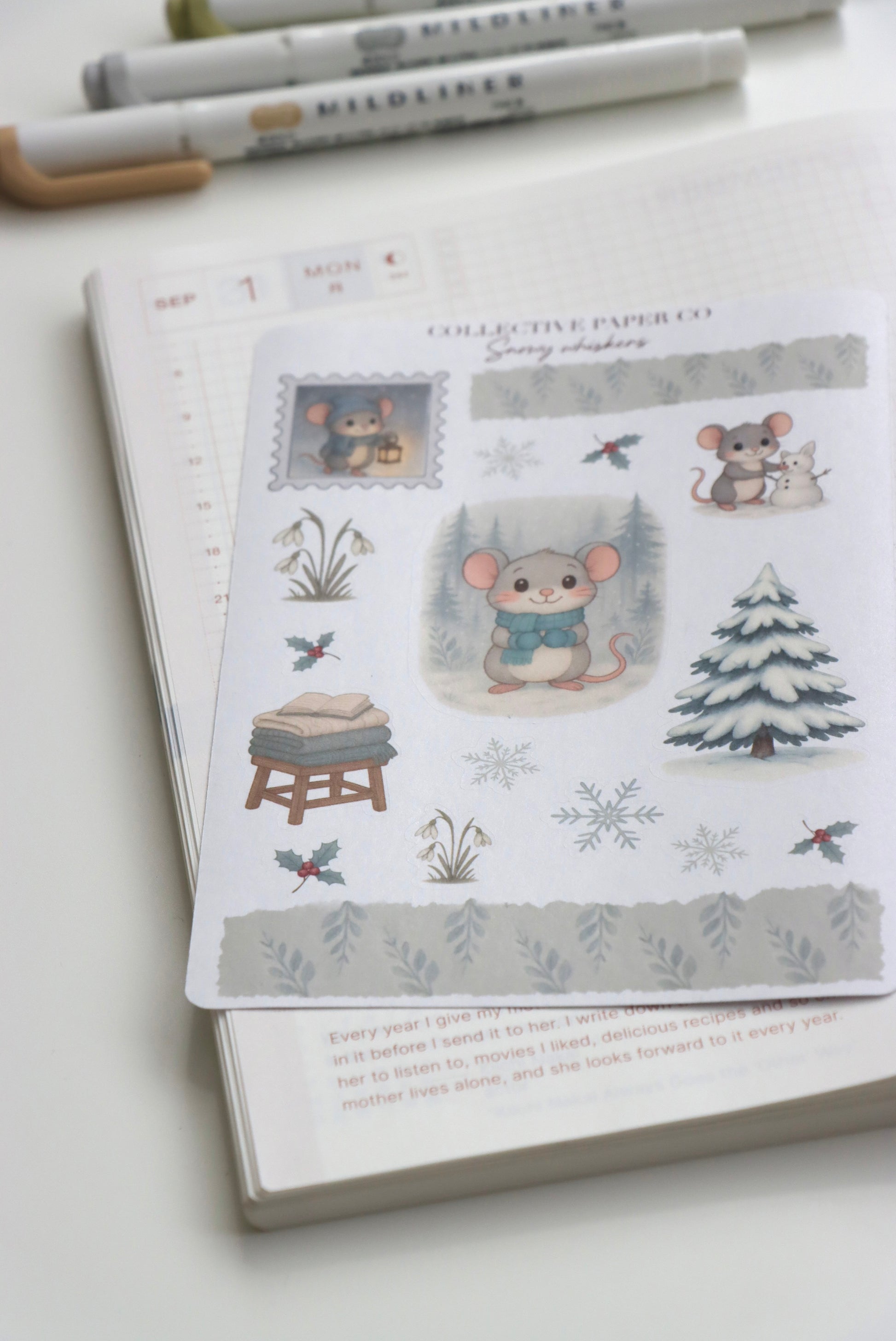 Decorative journaling sheet of kiss-cut seasonal stickers of Snowy Whiskers on Japanese washi paper