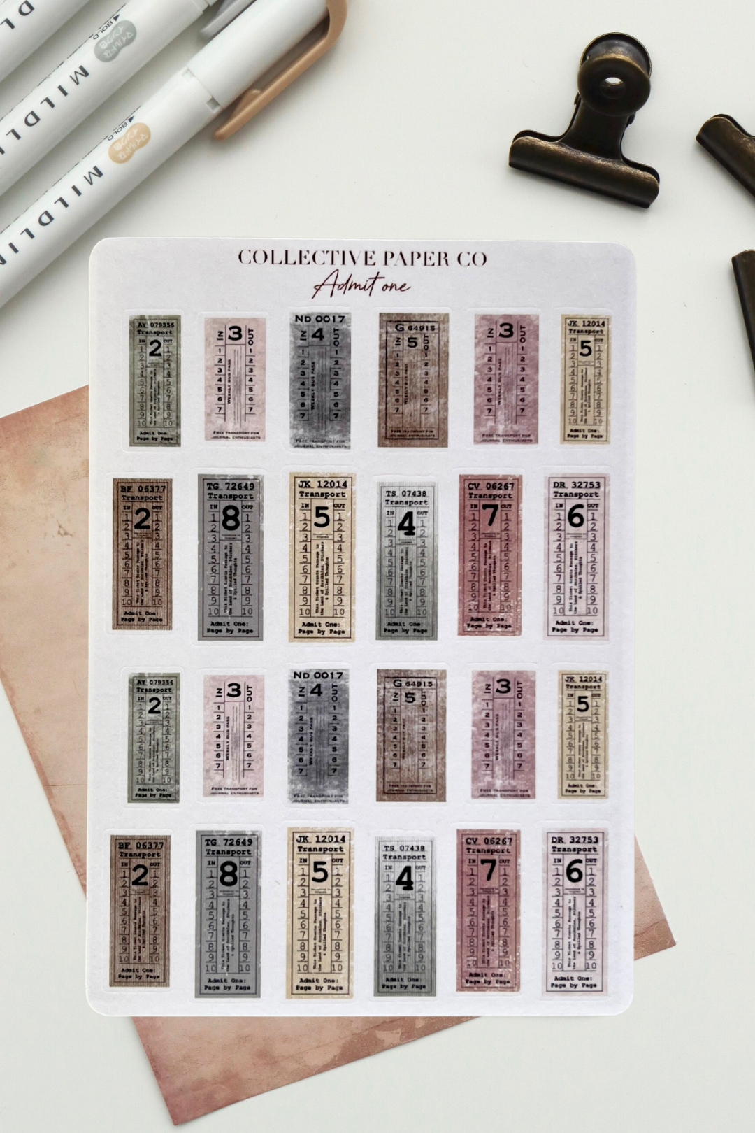 Sheet of stickers from Collective Paper Co. with various designs on a white surface.