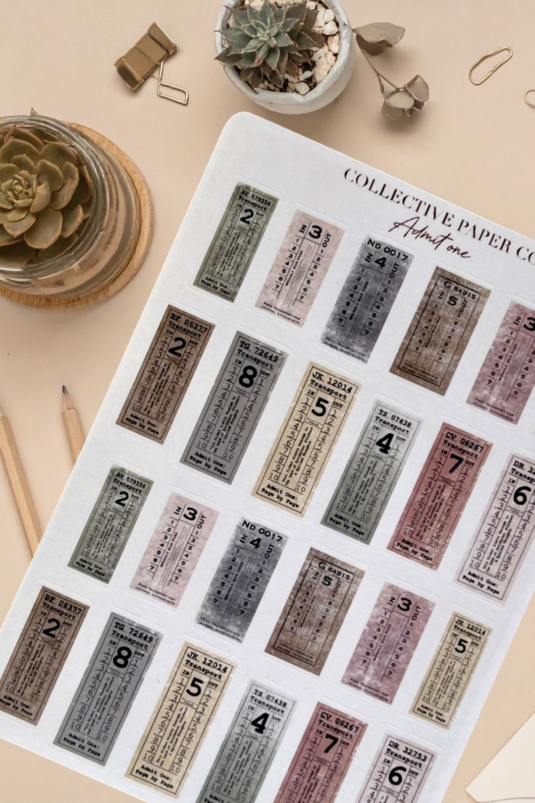 Sheet of vintage-style stickers with numbers on a beige surface with decorative items.