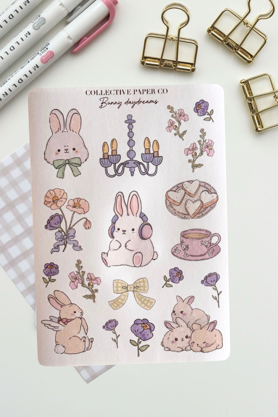 Bunny daydreams sticker sheet with pastel crayon style illustrations of bunnies, flowers, chandelier, heart cookies, floral teacup and a yellow bow in soft dreamy colours from Collective Paper Co