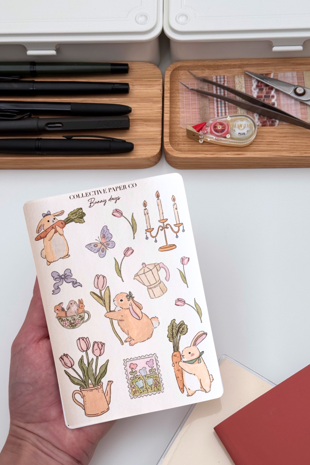 Bunny days sticker sheet with soft crayon style illustrations of rabbits, tulips, butterflies, candlestick, coffee pot, teacup with bunnies and a spring garden postage stamp from Collective Paper Co