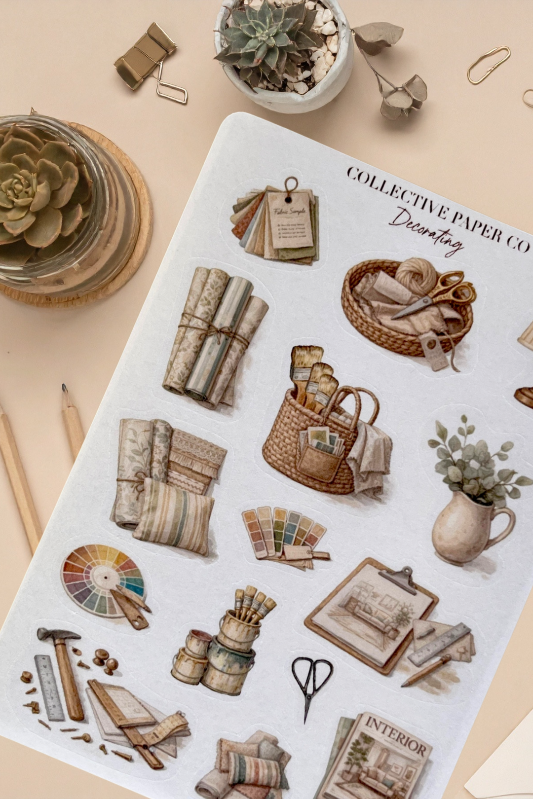 Sheet of decorative stickers with illustrations of home decor items on a beige background.