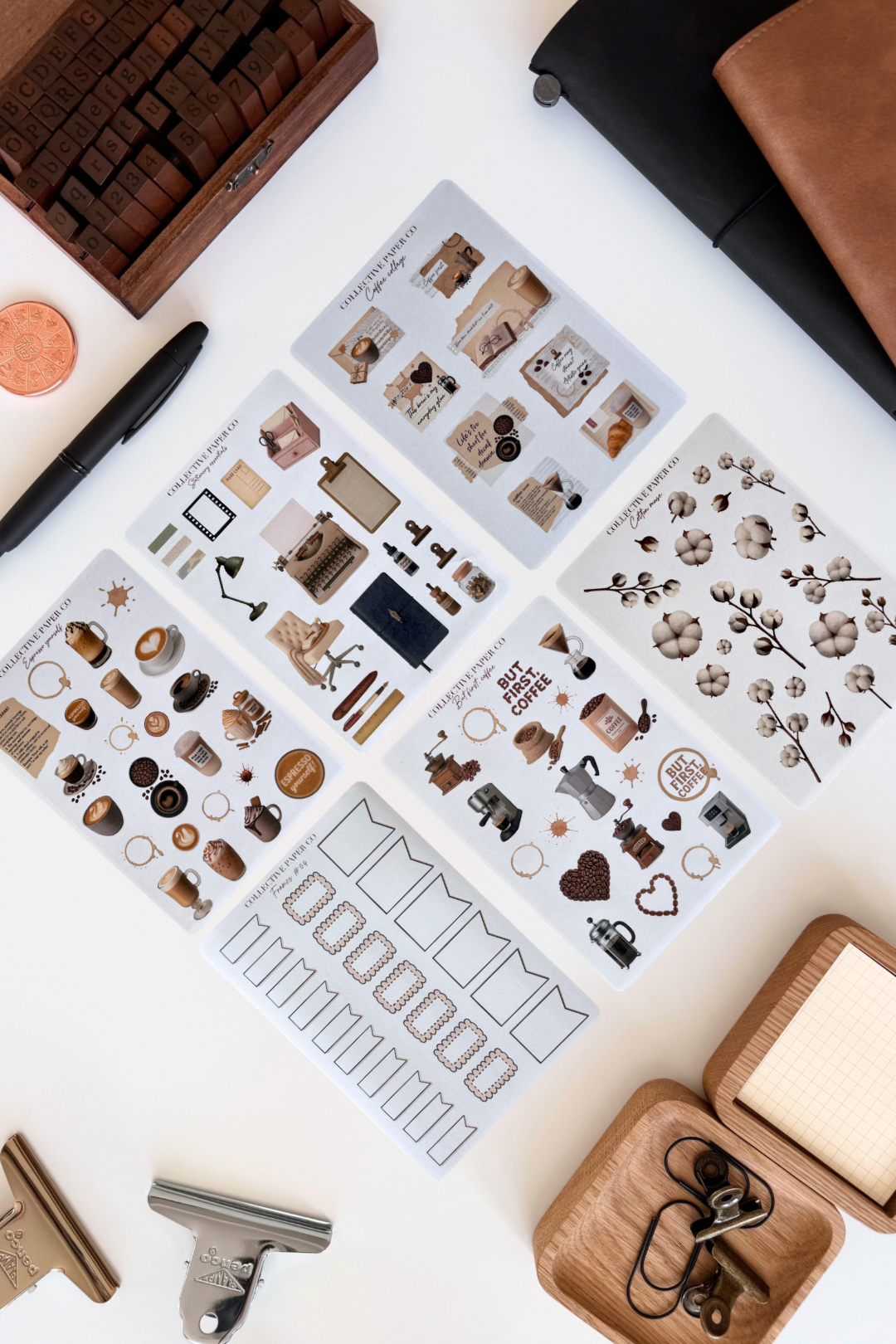 Collection of rubber stamps and stamping tools on a white surface