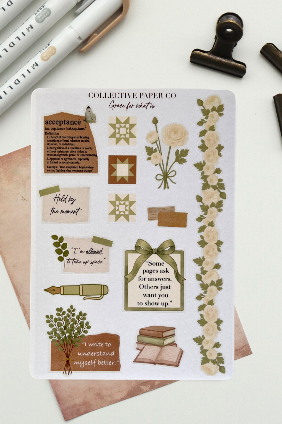 Sheet of decorative stickers with floral and text designs on a white background