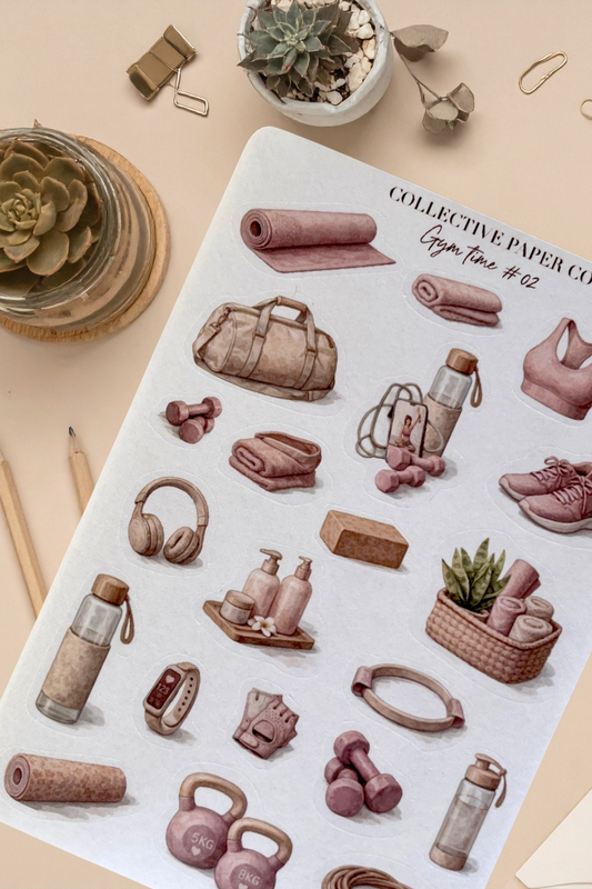 Sheet of illustrated gym-related stickers on a beige surface with plants and stationery items.