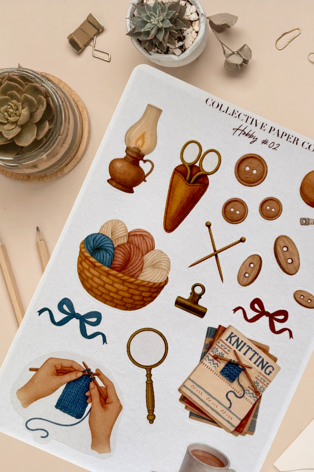 Sticker sheet with knitting-themed illustrations on a beige surface.
