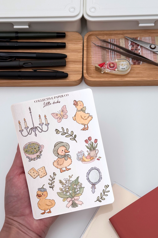 Little ducks sticker sheet with soft crayon style illustrations of ducks, floral teacup, crackers, bouquet, tulips, mirror, chandelier and leaves in pastel spring colours from Collective Paper Co