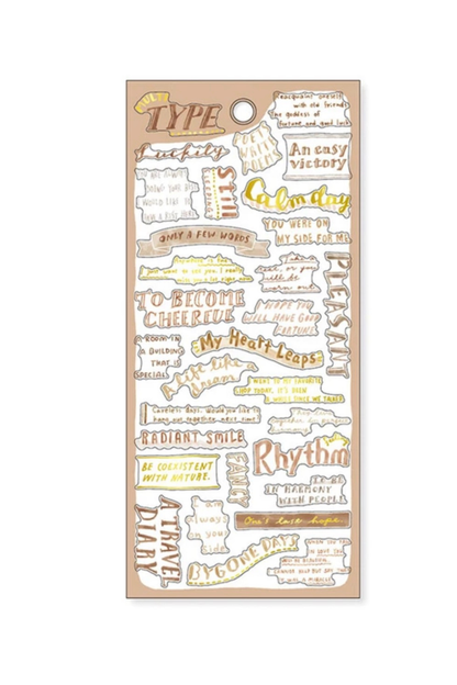 "Type" beige washi tape sheet with multicolored motivational quotes like "Cheerful," "Radiant Smile," and "Consistent" on tan background.

