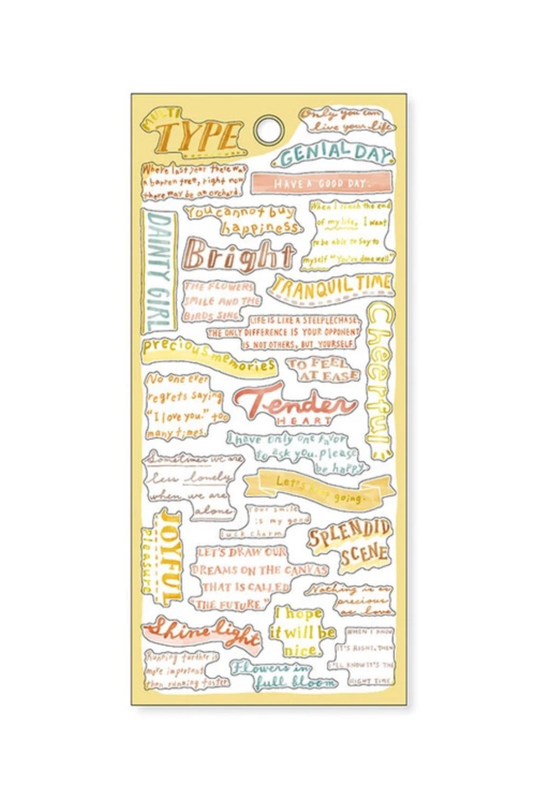 "Type" yellow washi tape sheet with quotes like "Genial Day," "Tender," "Full Bloom" on gold background.