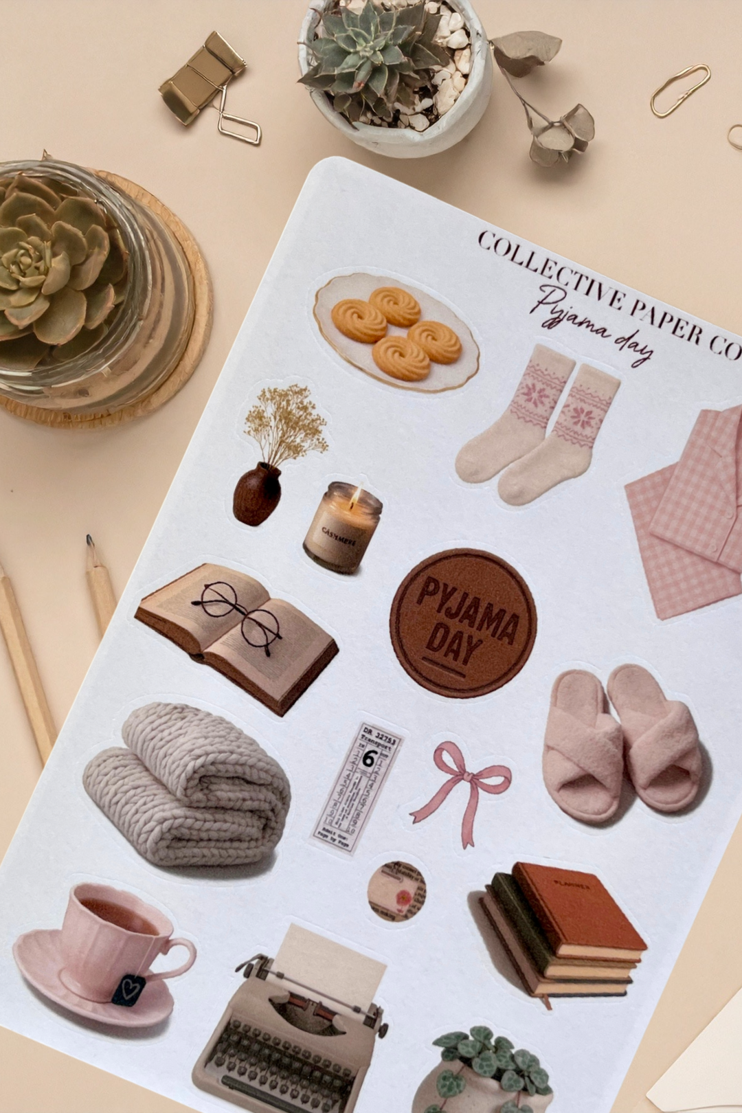 Sticker sheet with various cute illustrations on a beige surface.