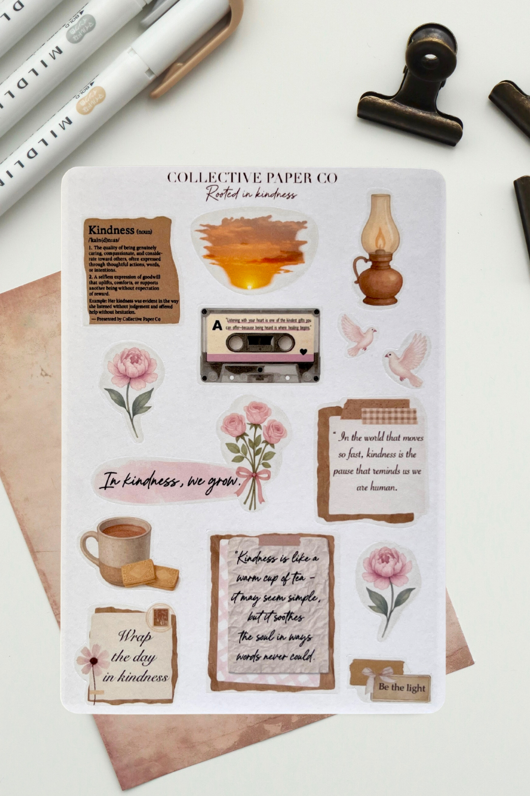 Sheet of decorative stickers with various designs including flowers, a cassette tape, and text on a white background.