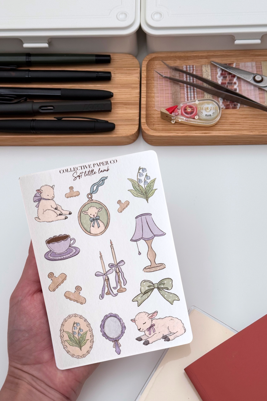 Soft little lamb sticker sheet with pastel crayon style illustrations of lambs, tea cup, candles, lamp, ribbons, florals and vintage frames in gentle lilac and sage tones from Collective Paper Co