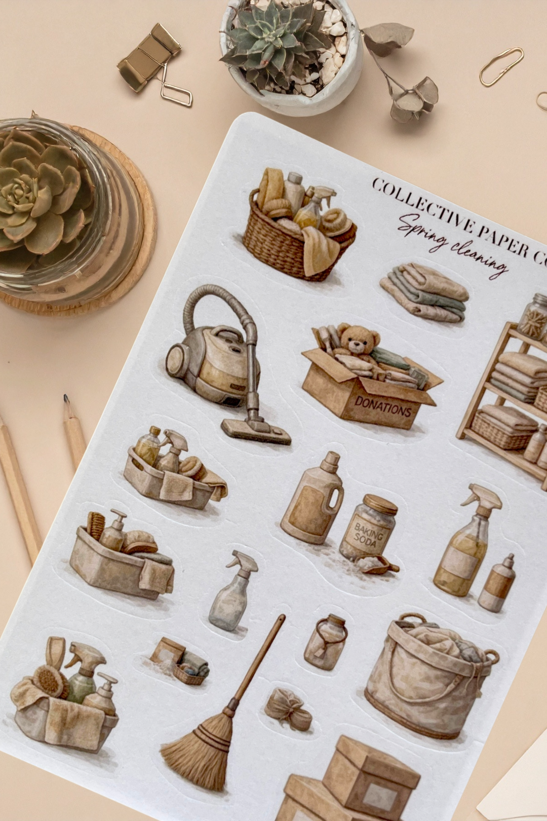 Sheet of decorative stickers with vintage-style cleaning supplies on a beige surface.
