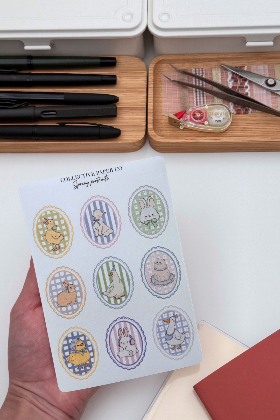 Sheet of nine pastel spring animal portraits washi stickers with ducks, bunnies, lamb, goose and cat in scalloped oval frames on gingham backgrounds.


