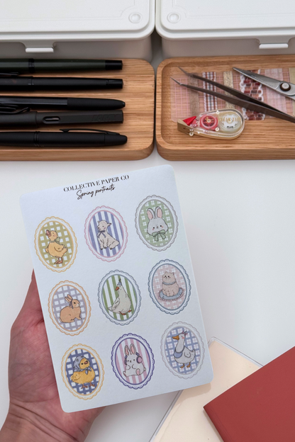 Sheet of nine pastel spring animal portraits washi stickers with ducks, bunnies, lamb, goose and cat in scalloped oval frames on gingham backgrounds.

