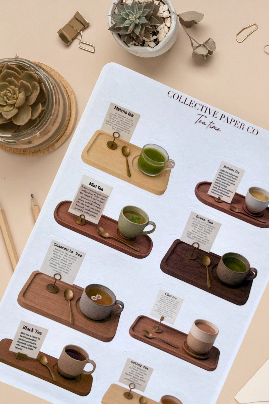 Tea time stationery set with wooden trays, cups, and notes on a beige background.