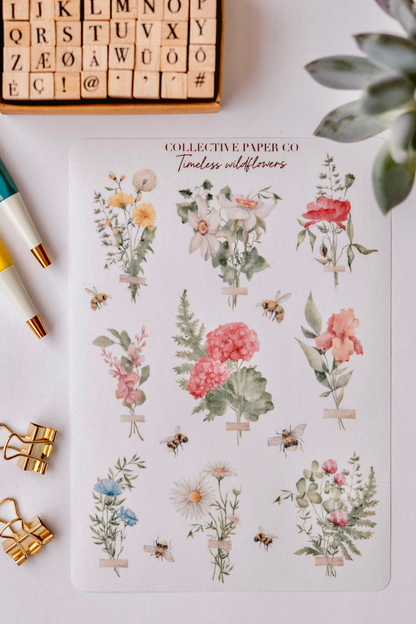 Collective Paper Co.'s Timeless Wildflowers washi tape displays watercolor bouquets of yellow daisies, white lilies, red poppies, pink peonies, ferns, butterflies, and bees with tape accents.