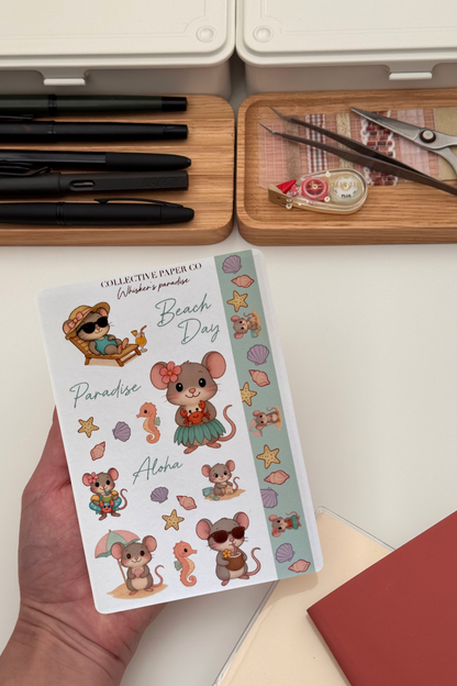 Sheet of mouse-themed stickers with a person holding it, surrounded by stationery items.