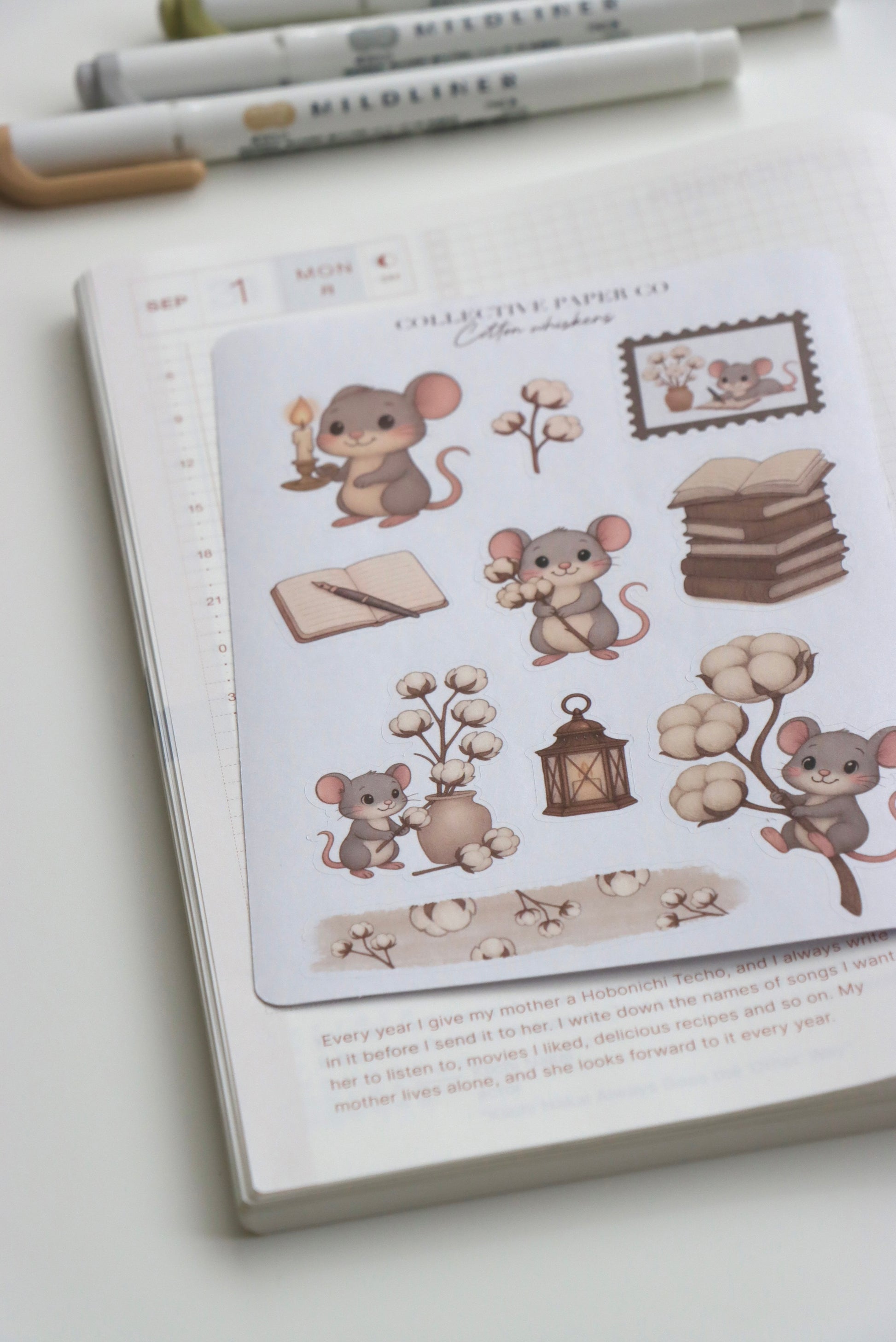 Decorative journaling sheet of kiss-cut stickers of Cotton Whiskers on Japanese washi paper
